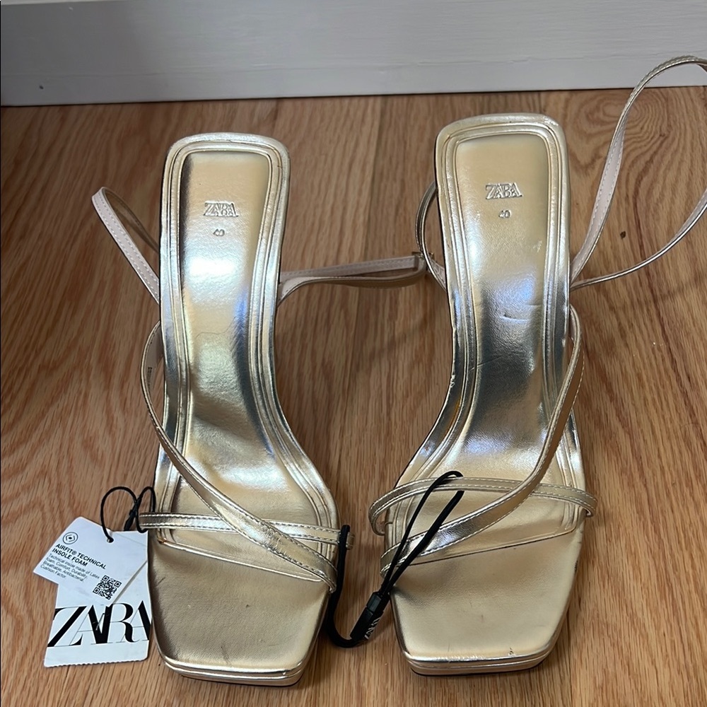 Zara women’s SZ 9, golden strappy heels.